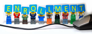 Enrollment banner with tiny dolls holding letters