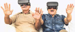 photo of an older couple wearing VR goggles