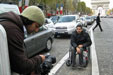photo of cameraman filming a man using a wheelchair