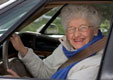 an older woman at the wheel
