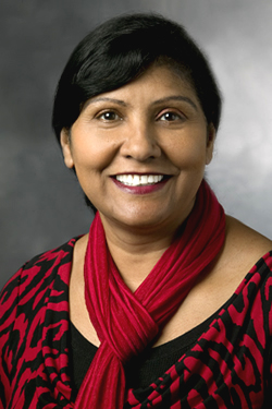 Photograph of Susan Singh with a Red Scarf and a red blouse