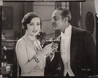 Alice Joyce  and actor having cocktails