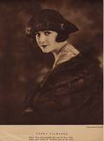 Norma Talmadge wearing a hat an fur wrap, portrait by Marceau