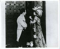 Film still from La Tosca, Frederick at door with feathered hat