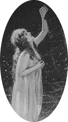 Norma Talmadge in chiffon shift reaching into a tree